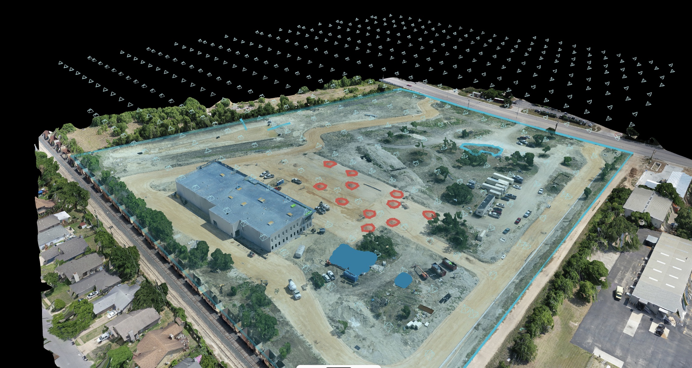 Oblique 3D model of an industrial site with buildings and graded areas visible.