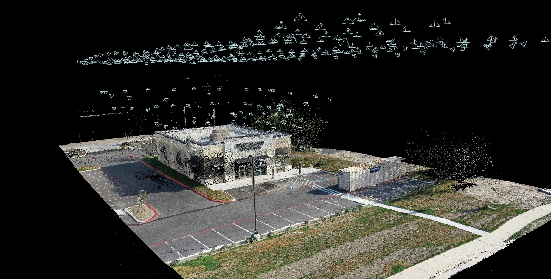 Oblique 3D model of a commercial building with camera position markers above the scene.