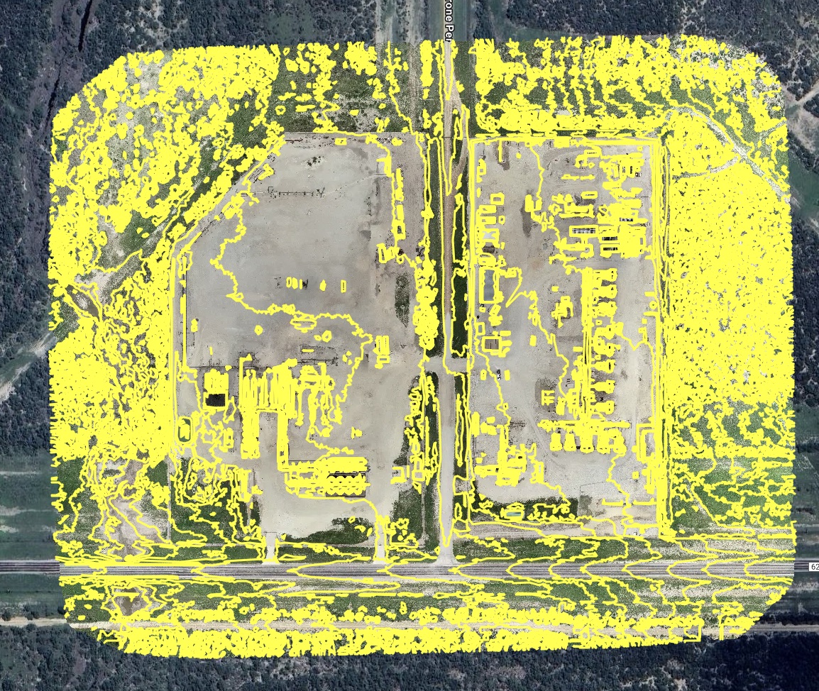 Dense yellow point cloud overlay on a site map indicating scan coverage.