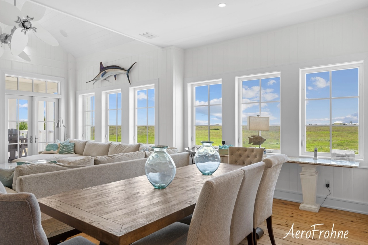 Dining area with large windows and coastal views