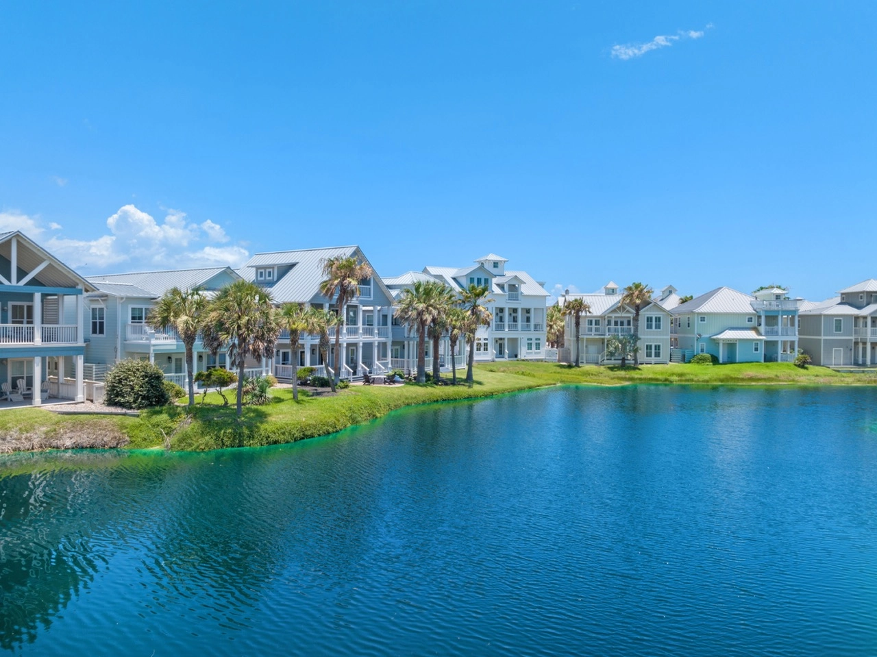 Drone view of a resort lagoon with condos surrounding the water