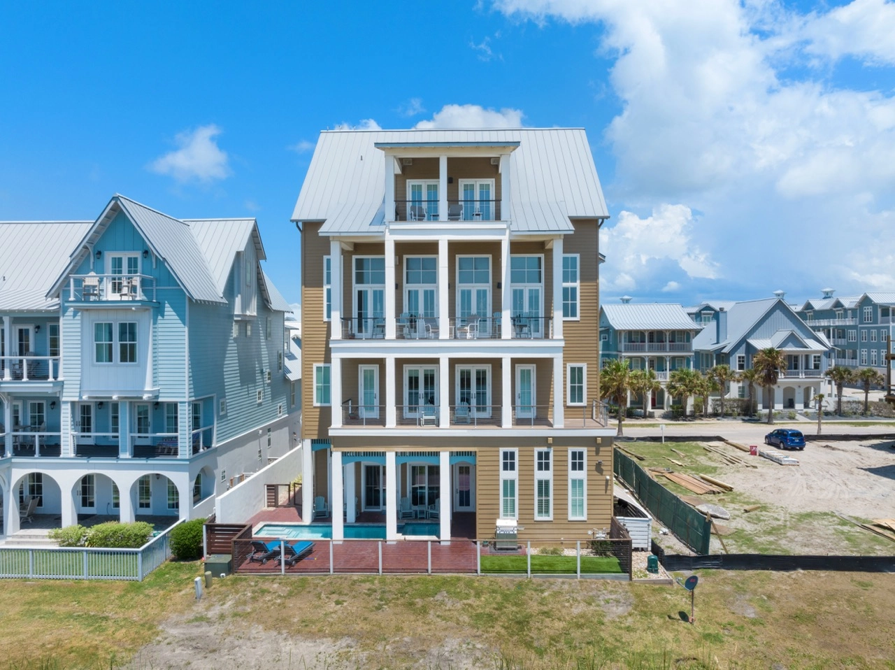 Front exterior of a multi-story beach house in a coastal community