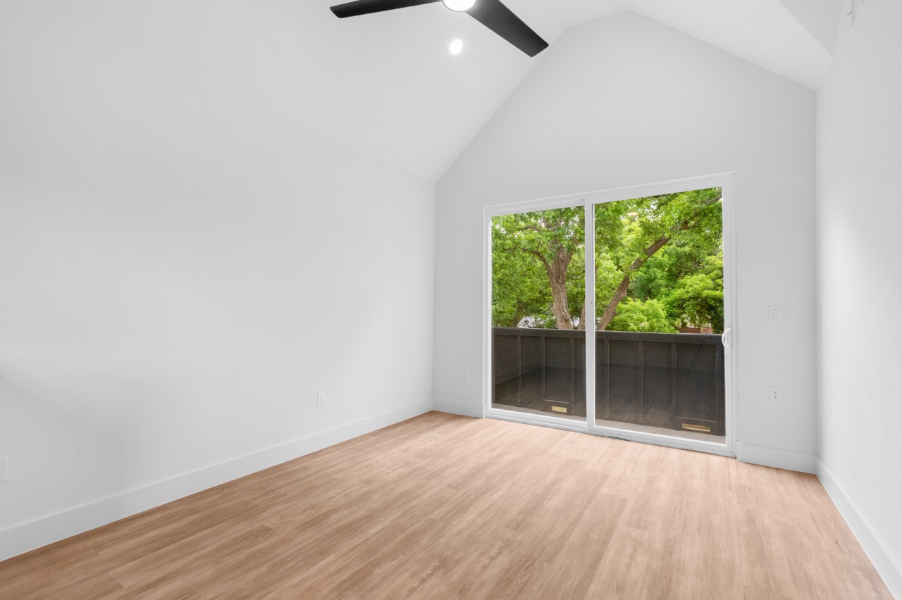 Empty Bedroom with Vaulted Ceilings
