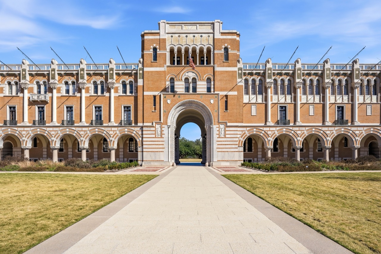 Wide, symmetric front view of Lovett Hall at Rice University, showing the full architectural scale and grand entryway detail