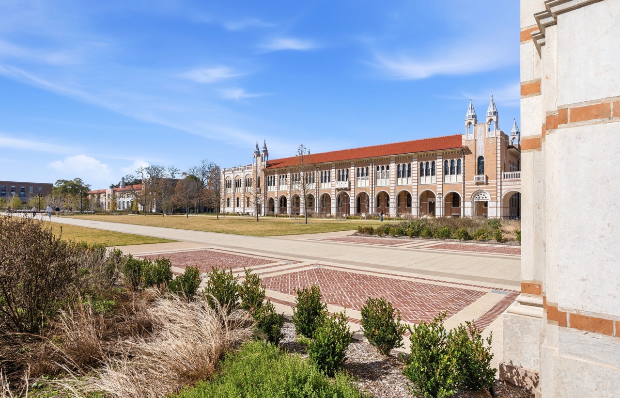 Extensive front lawn and symmetric facade of Lovett Hall at Rice University, Houston