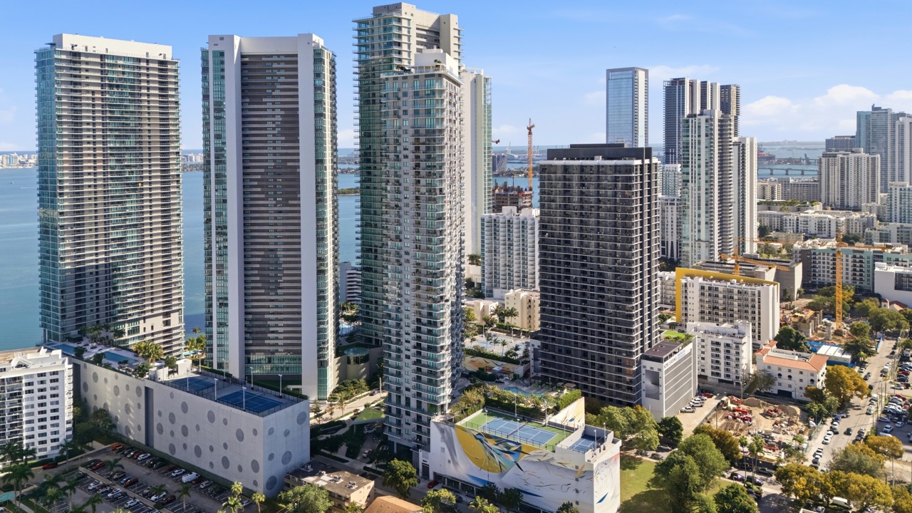 Close-up detail of Paraiso Bayviews glass balcony architecture.