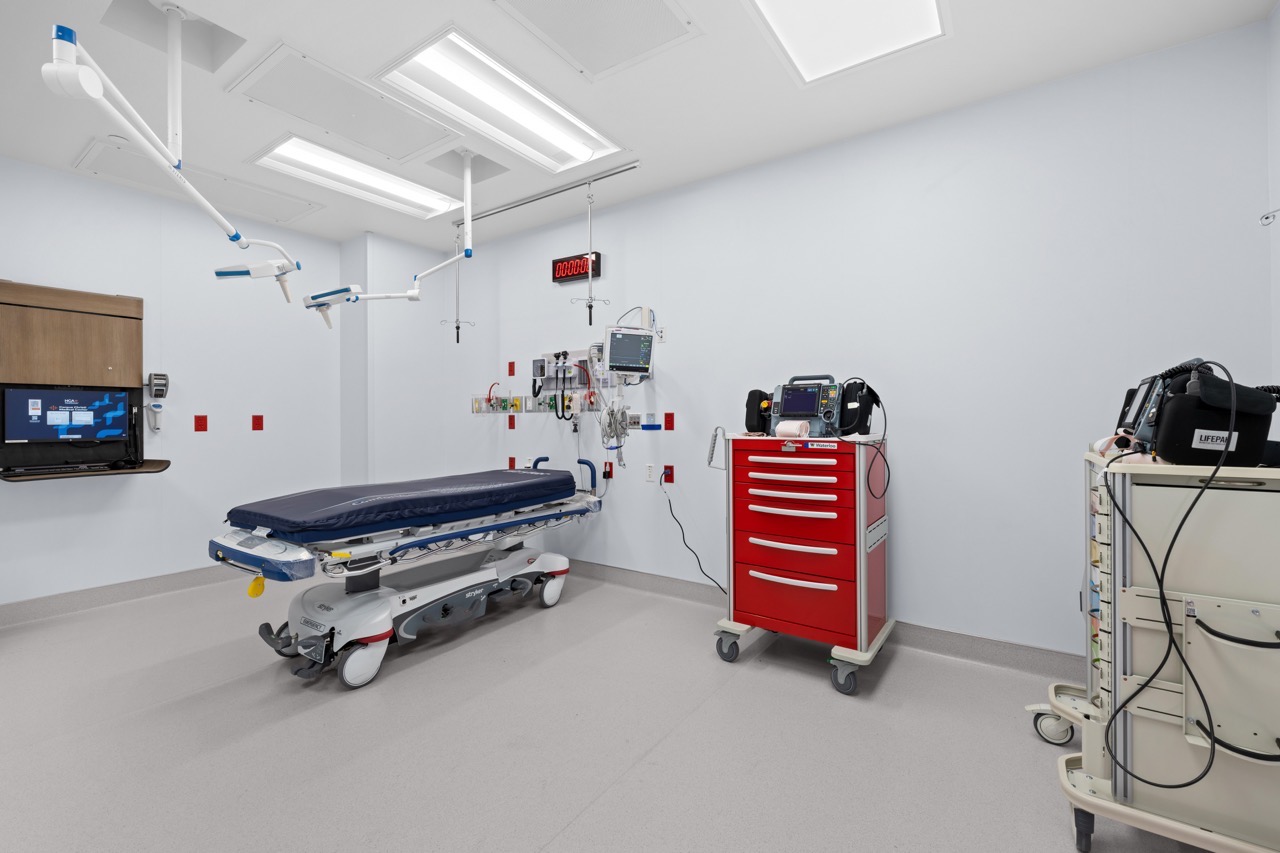 A hospital emergency room bay with a stretcher and medical equipment