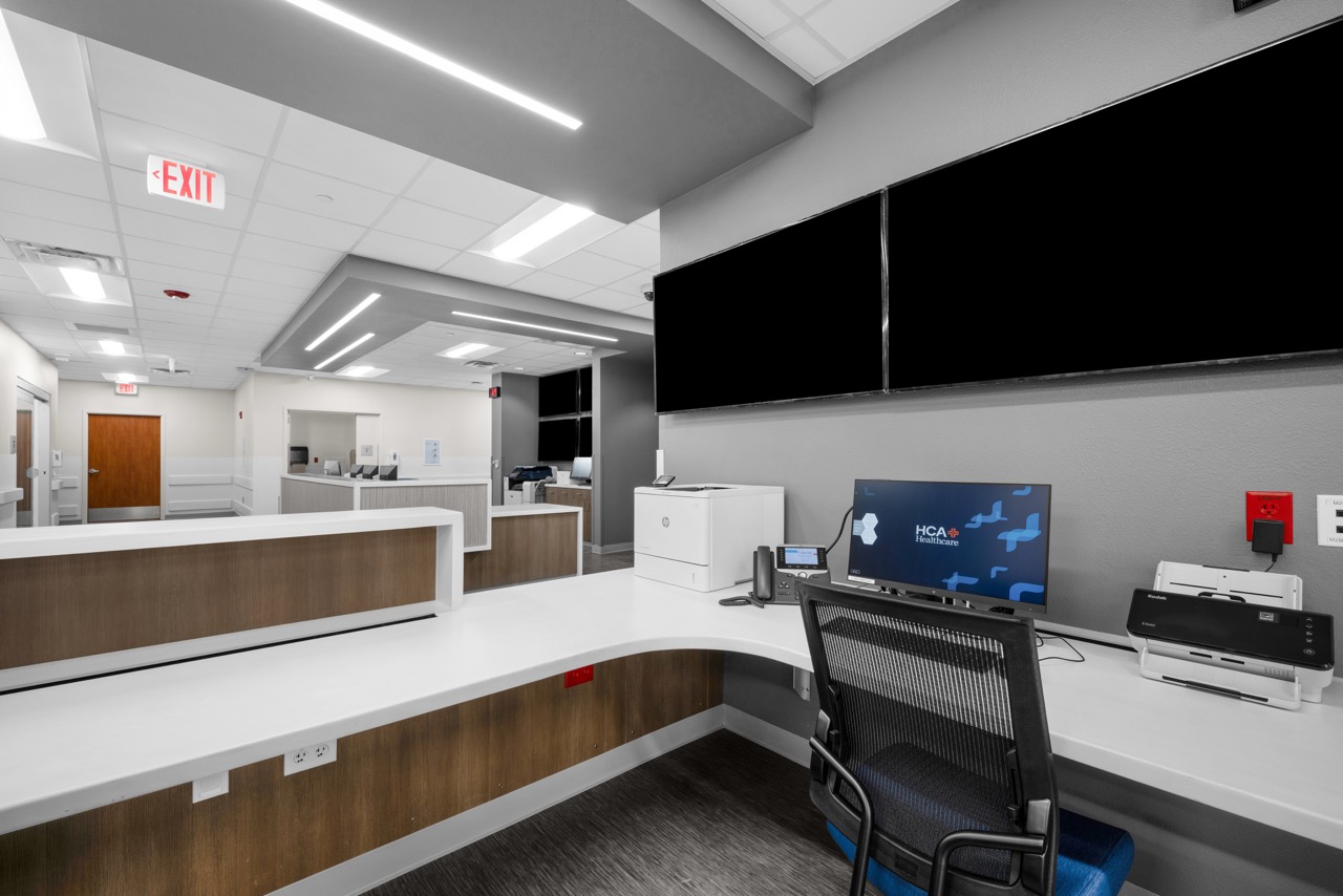 A view from behind the desk inside a modern nurse's station at Bay Area Medical Center Corpus Christi