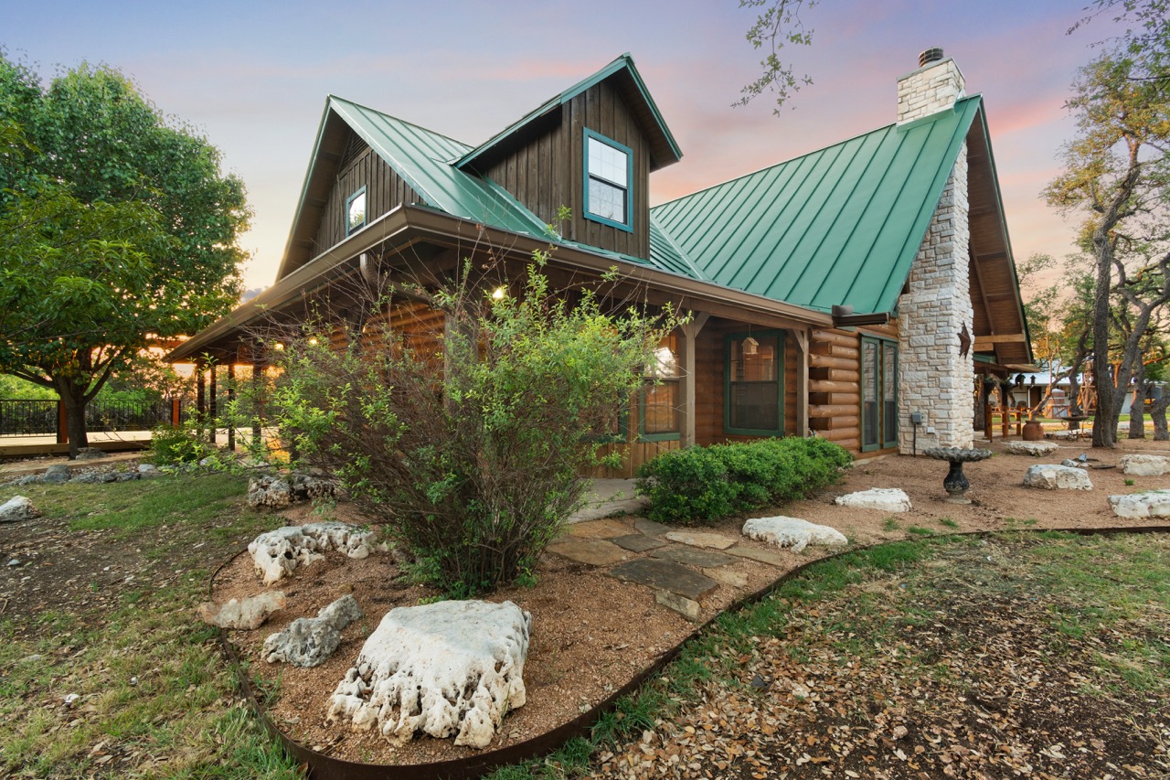 Twilight exterior of rustic home