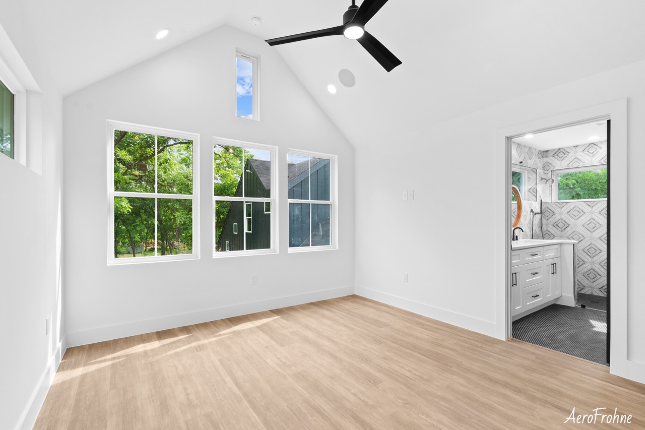 Interior bedroom with vaulted ceiling