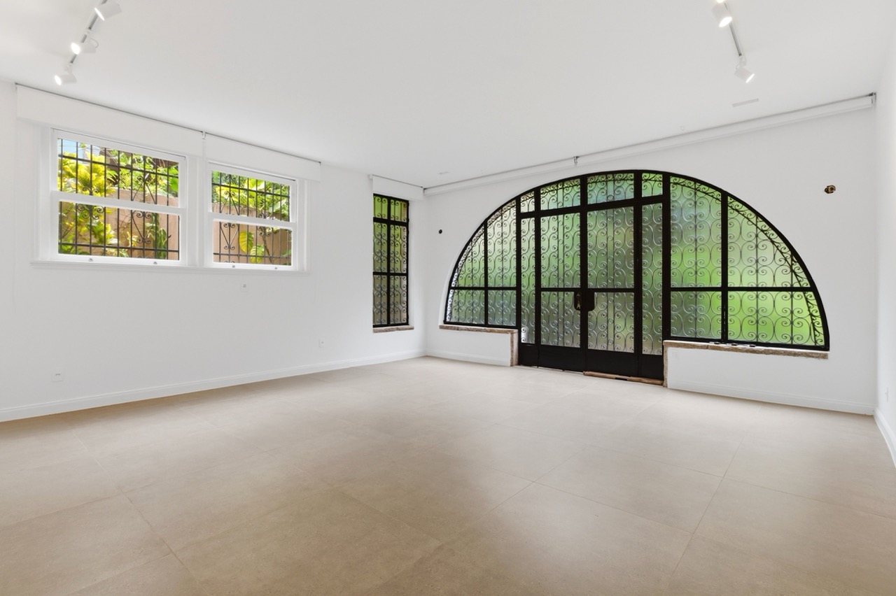 Renovated Room with Arched Window
