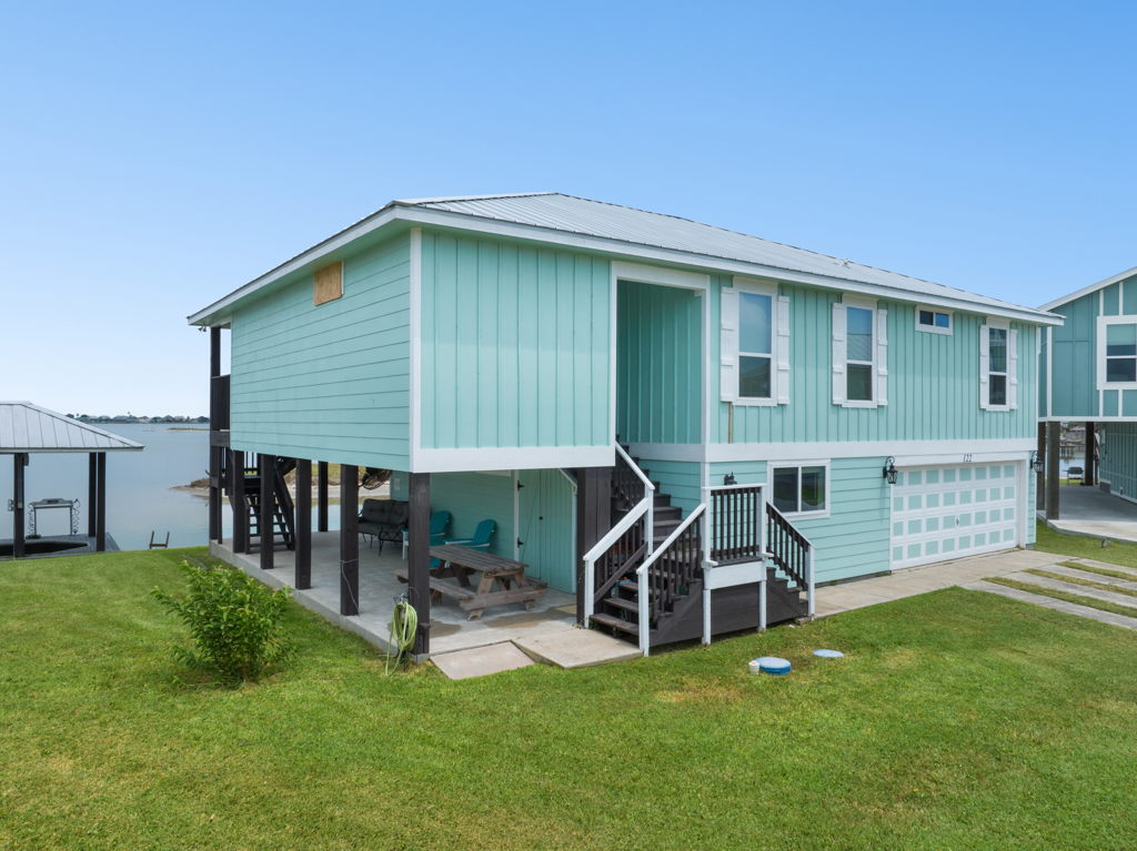 Street view of the teal stilt house