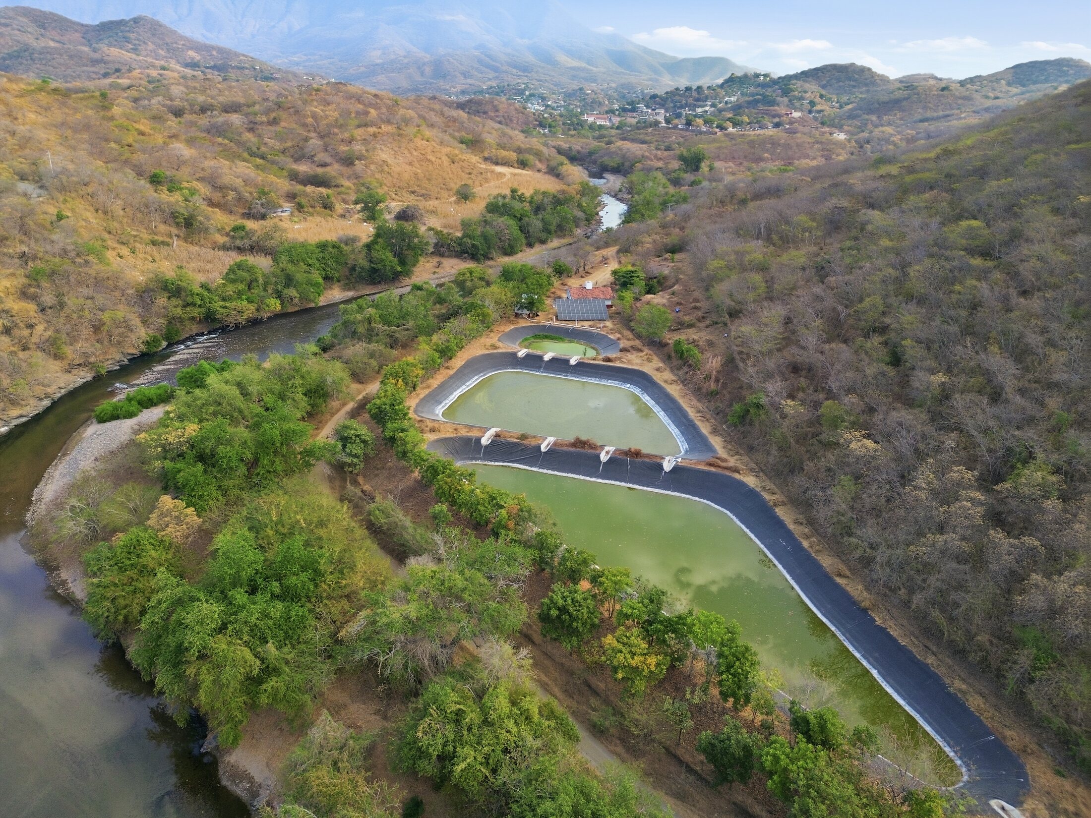 Wide aerial topographic mapping view of reservoirs and a river