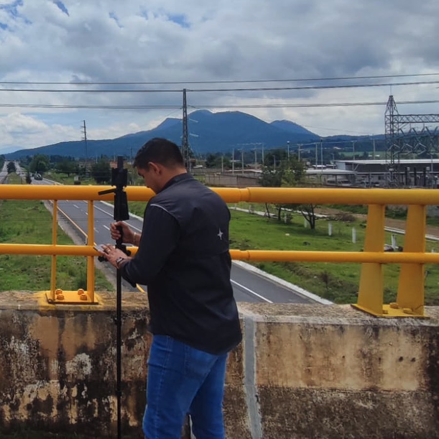 Edgar Jesús López Rosales performing field surveying work
